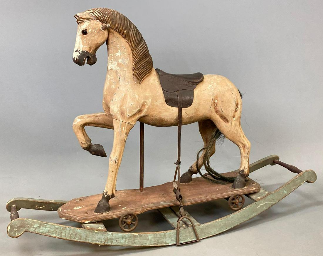 Older Converted Wooden Rocking Horse With Leather: Older Converted Wooden Rocking Horse with Leather Saddle and attached wheels, approximately 32.5 x 45 x 14.5 inches