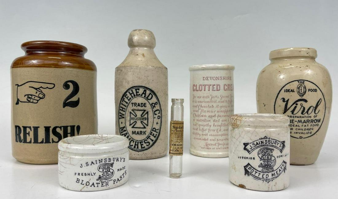Lot Of Stoneware, Including Antique Advertising Pieces: 6 Porcelain Food Storage Jars and Pharmaceutical vial. Sizes range from 0.5 x 3.125 in to 4.125 x 4.125 x 5.875. Some markings include Relish, Virol Bone-Marrow, Horner's Clotted Cream, J. Sainsbury's