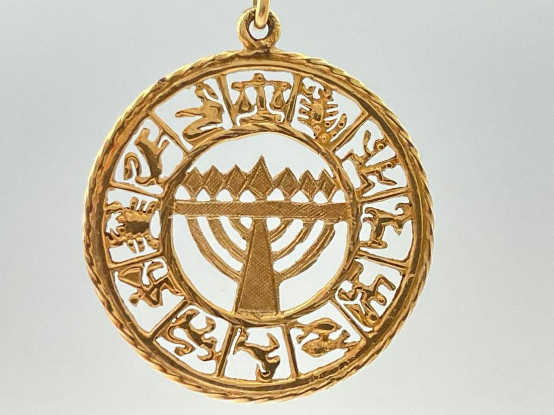 14K Gold Menorah Pendant. 4.4G: 14K Gold Menorah Pendant. 4.4g. Marked 14K. Approximately 1.125 in width. ALL CREDIT CARDS WILL BE MANUALLY VERIFIED PRIOR TO SHIPMENT.