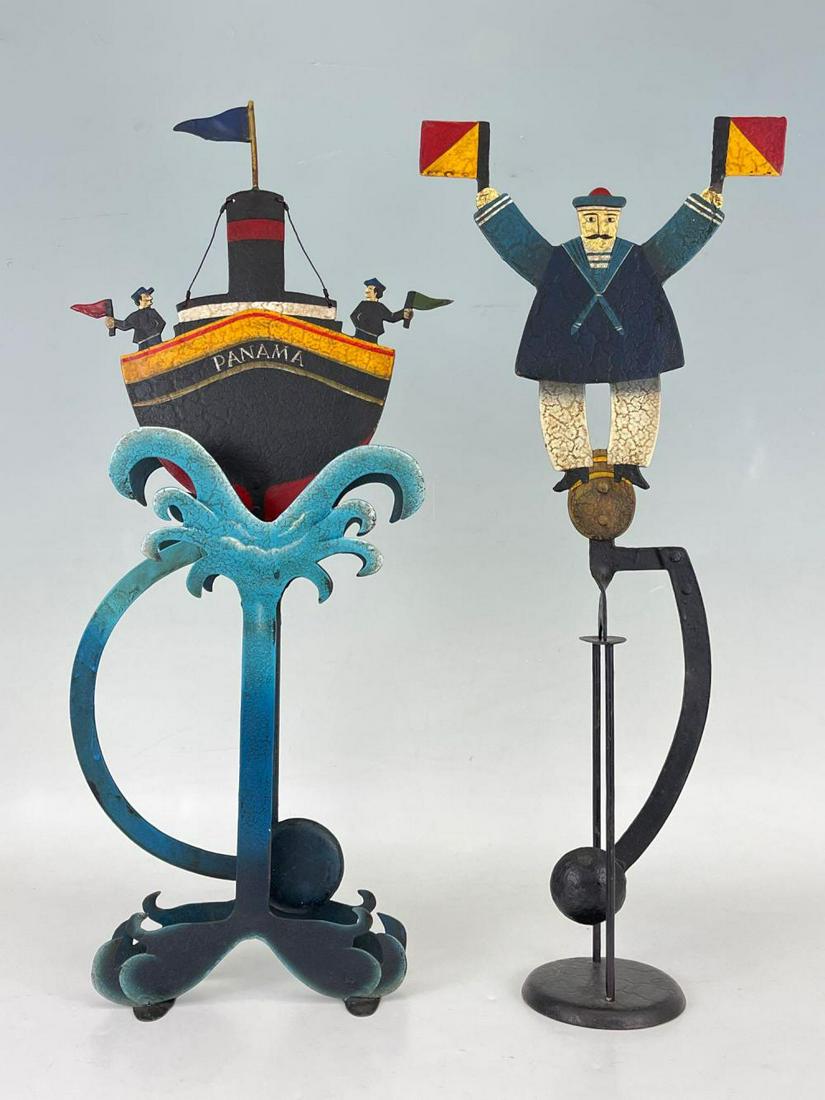 Pair of Whimsical Nautical Garden Art Balancing Figures: Pair of Whimsical Nautical Garden Art Balancing Figures. Boat with Stand 23.5 in x 10.25 in x 3 in, Man with stand 22.5in x 9.25 in x 4 in. Measurements are approximate.