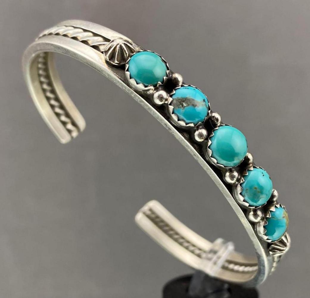 Navajo Sterling Silver Cuff With 5 Bezel Set Turquoise: Navajo Sterling Silver Cuff With 5 Bezel Set Turquoise Stones, 21.2 g. By Silver Smith Ray King. Cuff break .75 in. Inside measurement 5.25. Measurements are approximate. ALL CREDIT CARDS WILL BE MAN