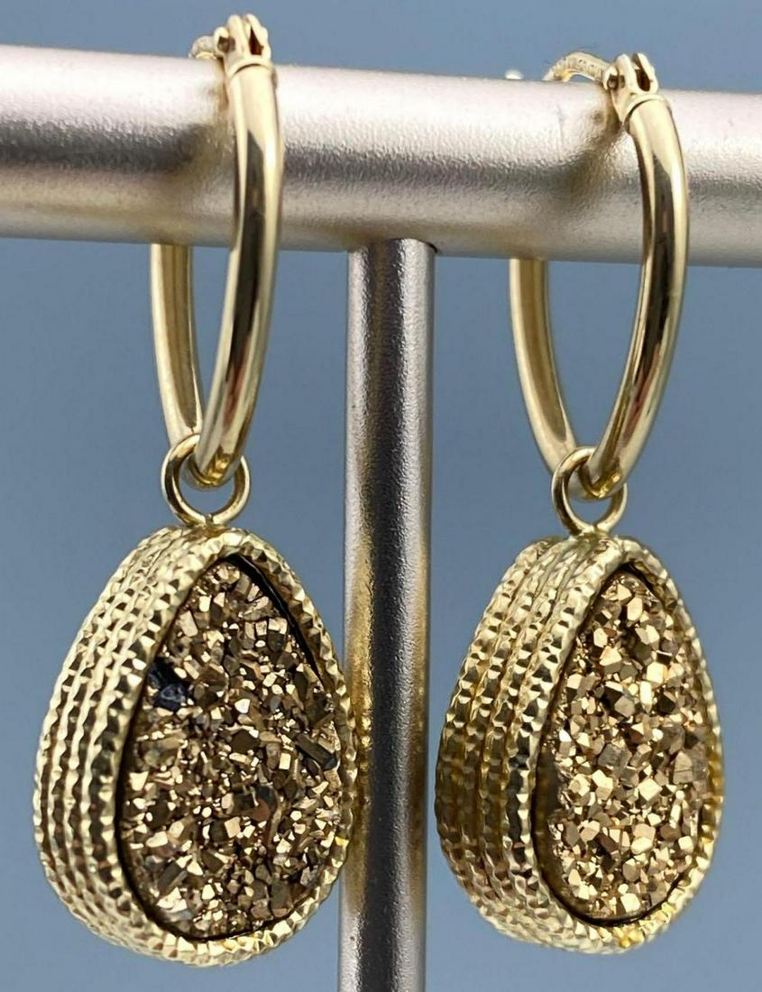 14K Gold Double Sided Drusy Earrings: 14K Gold Double Sided Drusy Earrings. 2.8g. Marked 14KT Milor Italy on each. Approximately 0.5 x 0.375 x 0.125 in not including clasp. ALL CREDIT CARDS WILL BE MANUALLY VERIFIED PRIOR TO SHIPMENT.