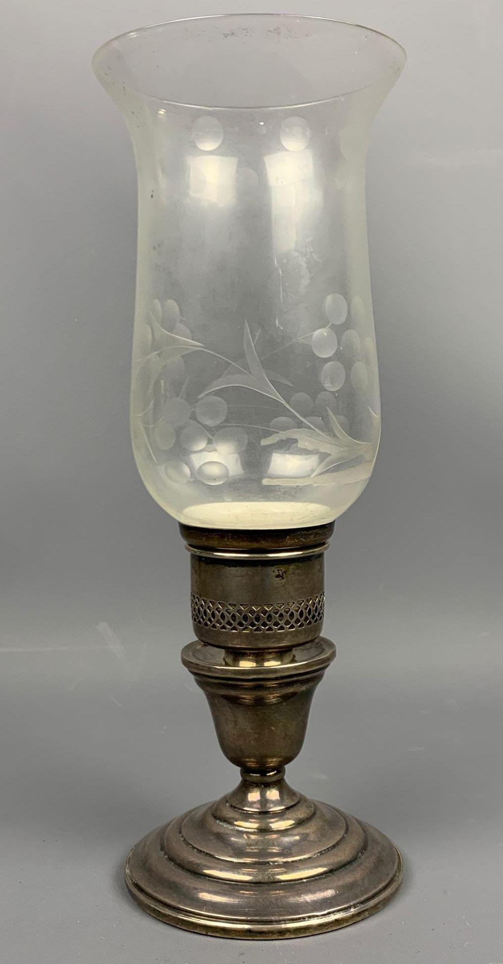 Sterling silver hurricane lamp with weighted base: Sterling silver hurricane lamp with weighted base. Approximately 10 x 3.75 in. SHIPPING AVAILABLE