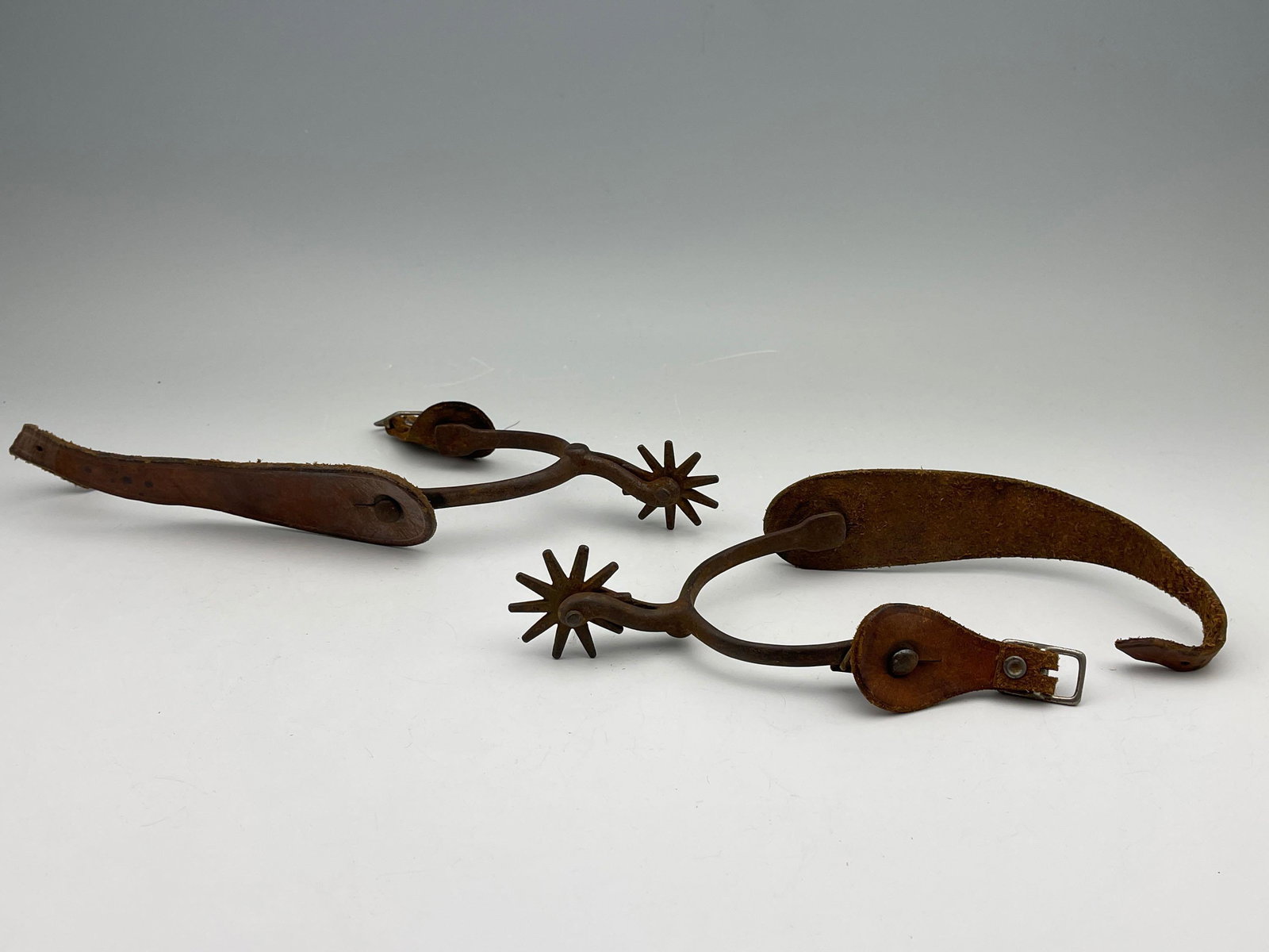 Vintage Leather Rowel 10 Tooth Swan Neck Spurs: Vintage Leather Rowel 10 Tooth Swan Neck Spurs. Yoke opening 2.825 in, shank 1.75 in, Rowels 1.75 in across. Measurements are approximate. From the private collection of the Estate Donald "Putt" Putm
