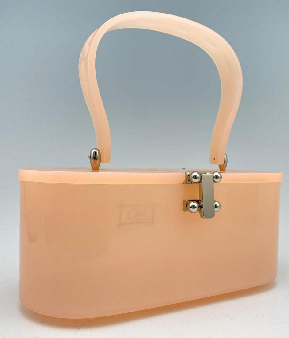 Vintage Miss L-Fire Peach Lucite Purse: Vintage Miss L-Fire Peach Lucite Purse. Approximately 8.5 x 8.125 x 4.25 in.SHIPPING AVAILABLE