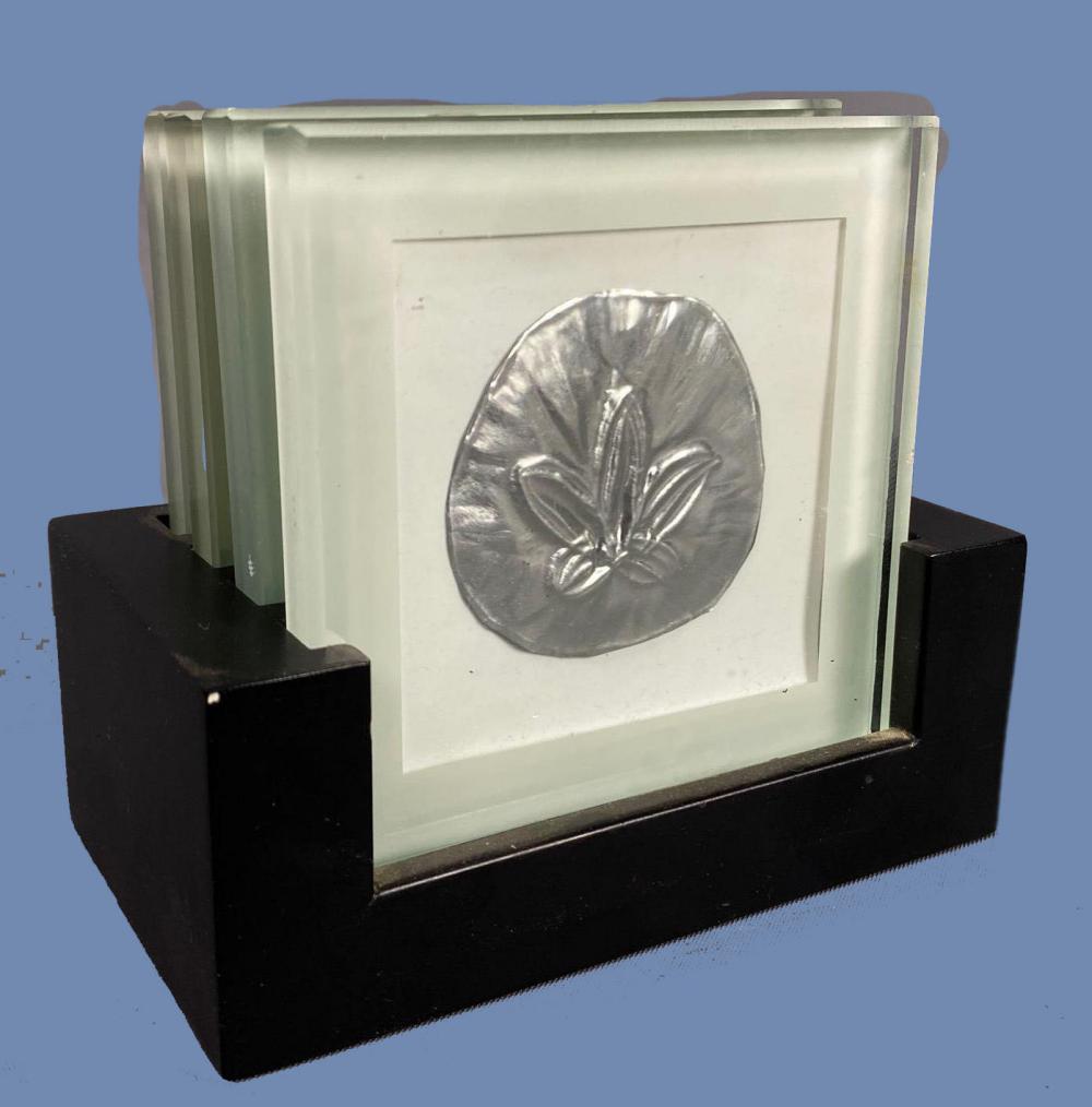 4 glass ocean themed coasters.: 4 glass sea themed coasters with tin pressed sea themed art.SHIPPING AVAILABLE