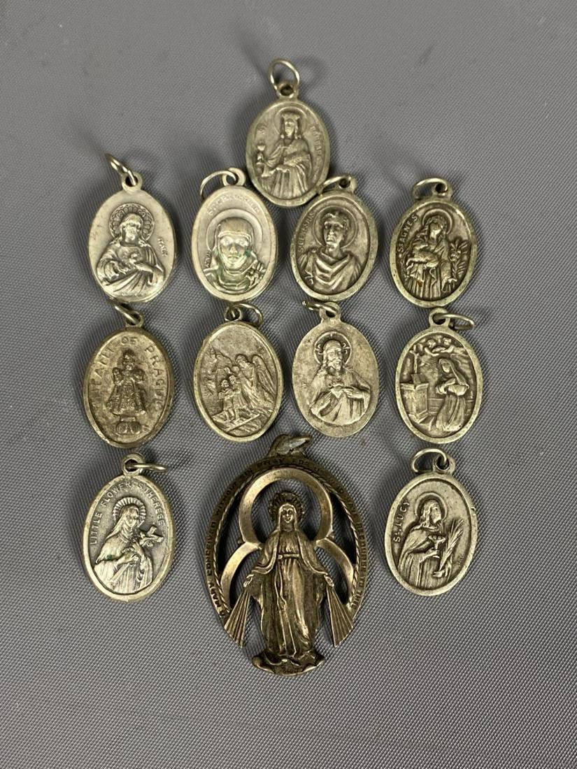12 catholic pendents.: 12 Catholic pendents Large pendant marked sterling Small pendants marked Italy.SHIPPING AVAILABLE