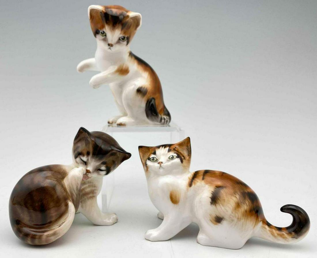 Royal Doulton Playful Kitty Figurines: 3 Royal Doulton England Bone China Cats. Smallest 2.25 x 2.125 x 1.75 in. Largest 3.5 x 1.875 x 1.5 in. All measurements are approximate.