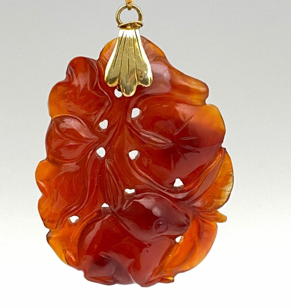 14k Gold Chinese Hand Carved Carnelian Pendant: 14k Gold Chinese Hand Carved Carnelian Pendant. 12.3g, Approximately 1.75 x 1.125 in. Marked 14k.