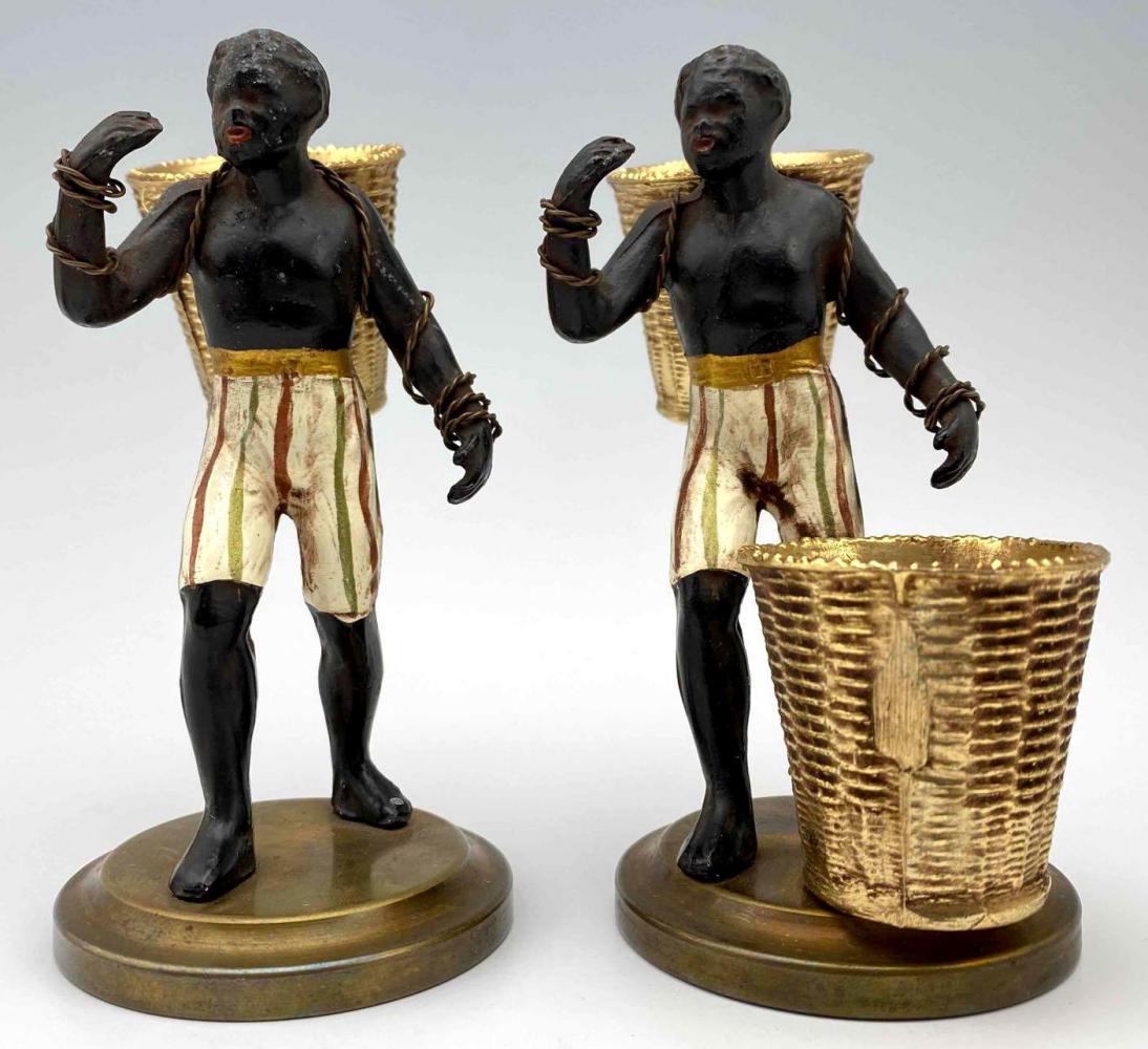 Pair of Black Americana Painted Metal Cotton Picker Figures: Pair of Black Americana painted metal figurines with gilt match holder baskets. Original antique paint, 19th century. Approximately 4.5H x 3.375W x 2.375D in.