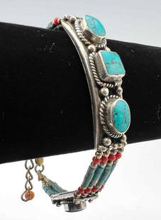 Tibetan Turquoise And Coral Bracelet: Tibetan Turquoise And Coral Bracelet. Approximately 8.7875L x 0.375W in.