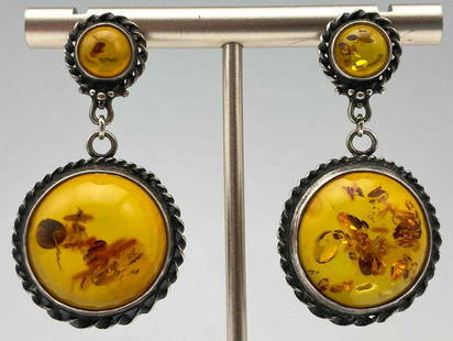 Sterling Silver Amber Drop Earrings: Sterling Silver Amber Drop Earrings. 10.6g. Approximately 1.75 x 0.9375 in.