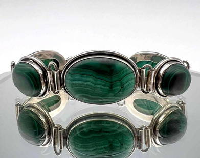 Sterling Silver Malachite Bracelet: Sterling Silver Malachite Bracelet. 7.8125L x 1.0625W x 0.3125D in. 61.6 grams. Tests as silver. This is an unusual bracelet in that the malachite is unpolished.