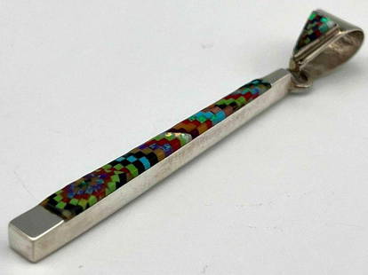 NavajoSterling Silver Inlay Drop Pendant: NavajoSterling Silver Inlay Drop Pendant. Marked Sterling. Signed TT. 3.9g. Approximately 2.5625L x 0.3125W in.