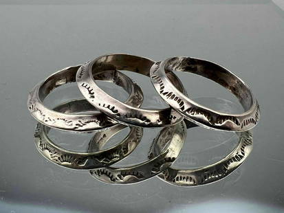 Three Navajo Sterling Silver Hand Stamped Bands: Three Navajo Sterling Silver Hand Stamped Bands. Marked Sterling. 13.3g. Size 8.5. .