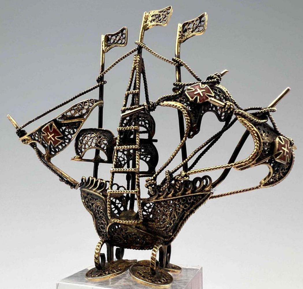 Silver Filigree Openwork Spanish Galleon Ship Figure: Silver Filigree Openwork Spanish Galleon Ship Figure, 12.7g. European, with enamel flags, probably Portuguese or Spanish in origin. Approximately 2.25H x 2.6875W x .75D in. ALL CREDIT CARDS WILL BE MA