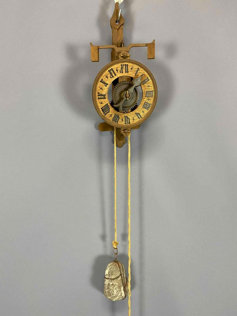 Wooden Wall Clock with Stone Weights: Weight Driven Wooden Wall Clock With Stone Weights. Approximately 68L x 6.625W x 4.5D in.