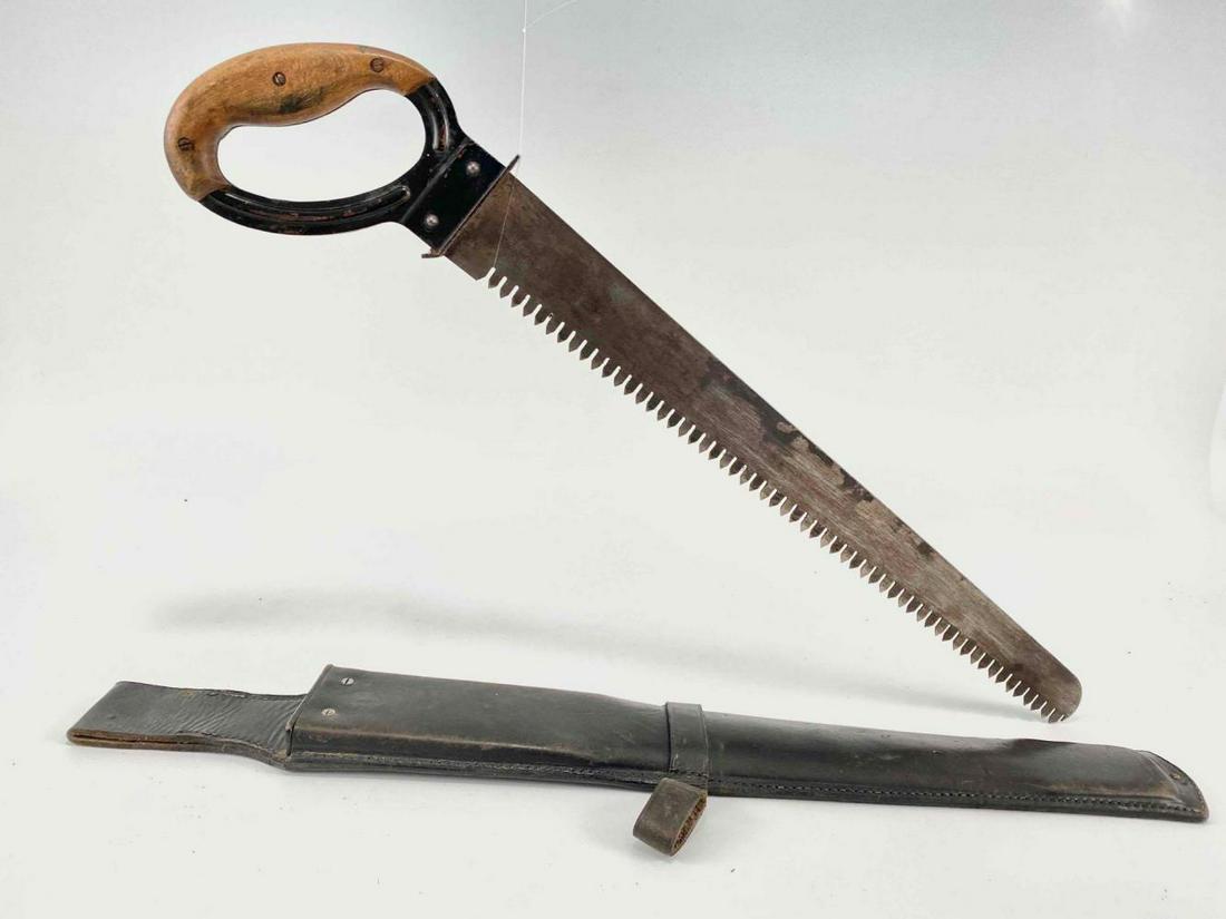 WW2 German Pioneer Sapper Saw and Holster: German Saw In Leather Scabbard. Scabbard Marked R Ehrhardt Poessneck 1937. Saw Blade Marked Ewald Schmahl, Cronenberg, WaA 145, With Third Reich Eagle. Saw Approximately 21.6875L x 4.375W x .9375D in.