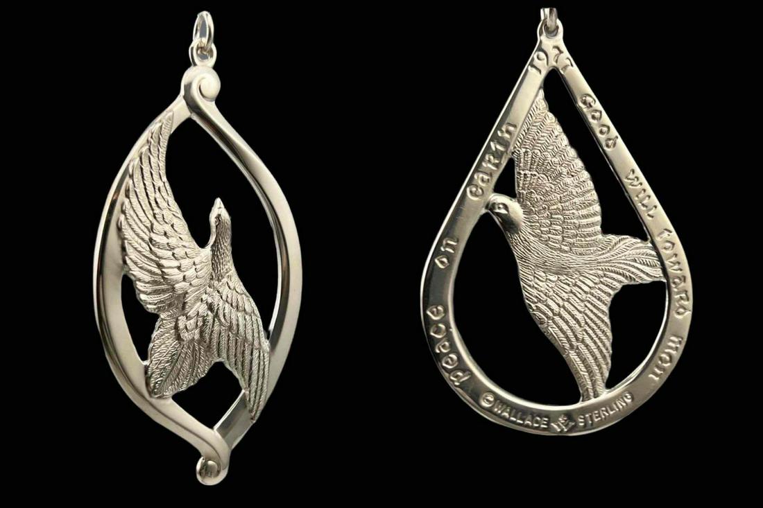 2 Sterling Silver Wallace Dove Pendants: 2 Sterling Silver Wallace Dove Pendants. 47.7g. Marked Sterling, Wallace. 1974 Peace On Earth Good Will Toward Men And 1977 Peace On Earth Good Will Toward Men. 1974 Pendant Approximately 3.25 L x 1.6
