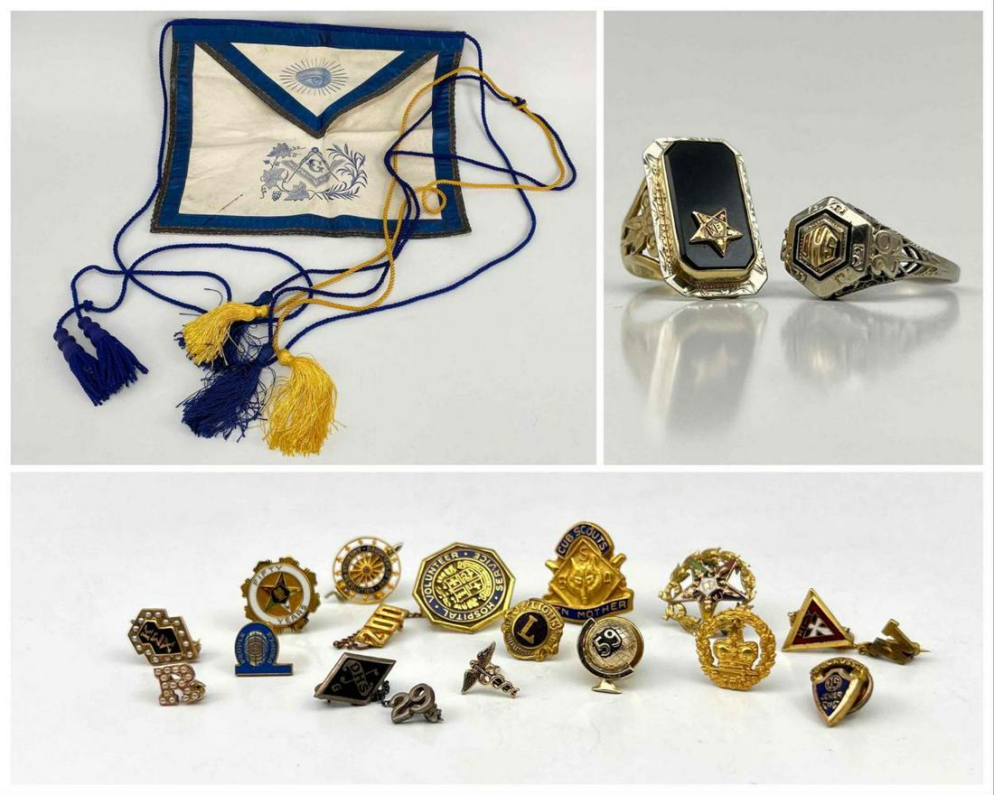 15 Fraternal Pins, Including 10K: 15 Fraternal Pins, Including 10K And Seed Pearls, Two 10K Gold Class Rings, And Freemason Banner. Weight Of 10K Pieces 7.3g. One Ring Marked Peters 1929, Both Test As 10 Karat. Two Pins Marked 10k.Fre