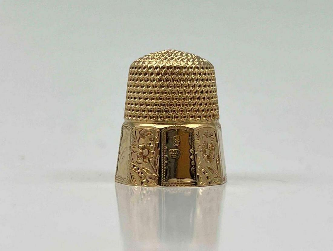 14K Gold Thimble With Engraved Flowers: 14K Gold Thimble With Engraved Flowers. 5.2g. Marked 14, 8, Crown Shaped Maker's Mark. Tests As 14K. Approximately 0.75H x 0.625W in. ALL CREDIT CARDS WILL BE MANUALLY VERIFIED PRIOR TO SHIPMENT.