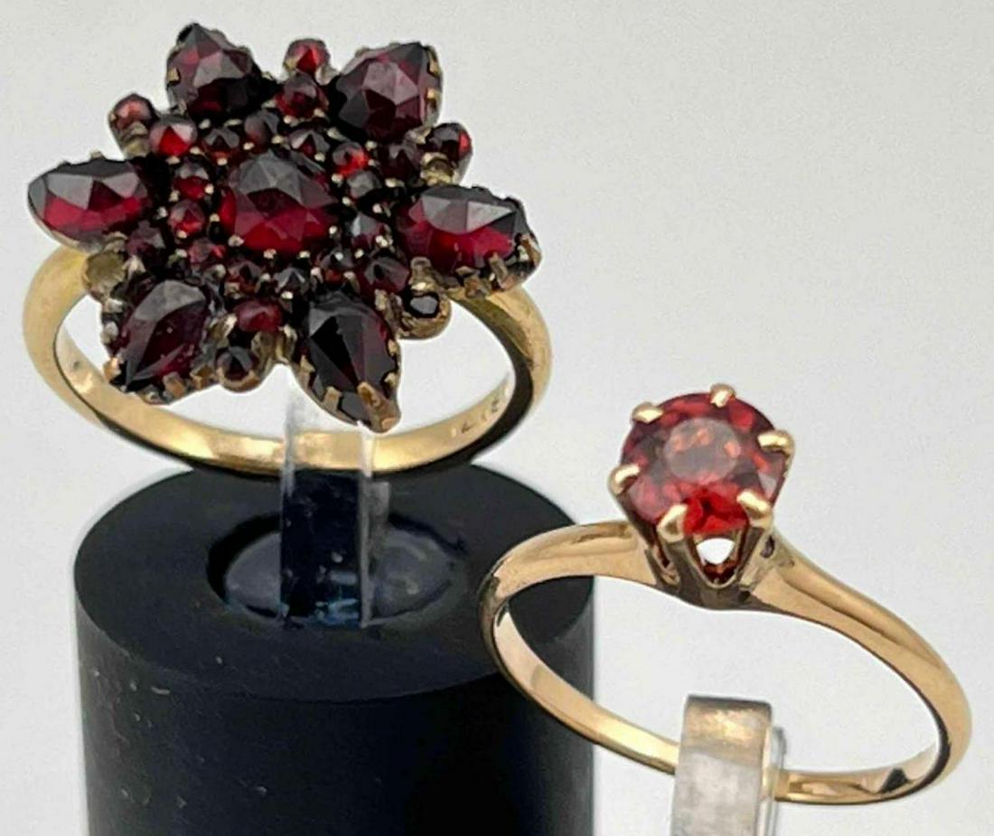 14K Gold Garnet And Tourmaline Rings: 14K Gold Garnet And Tourmaline Rings. 4.6g. Marked Both Bands Marked 14K M, And 14K L. Tourmaline Approximately 5.32mm. Largest Garnet Approximately 4.15mm. Sizes 4.75 And 5.25. ALL CREDIT CARDS WILL 