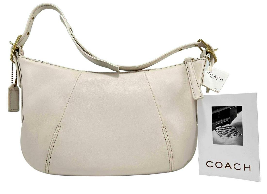 Coach Off White Leather Shoulder Bag: Coach Off White Leather Shoulder Bag. New With Tags. Approximately 12.75W x 8.0H in. Strap Approximately 18.75L x 1.375W in.