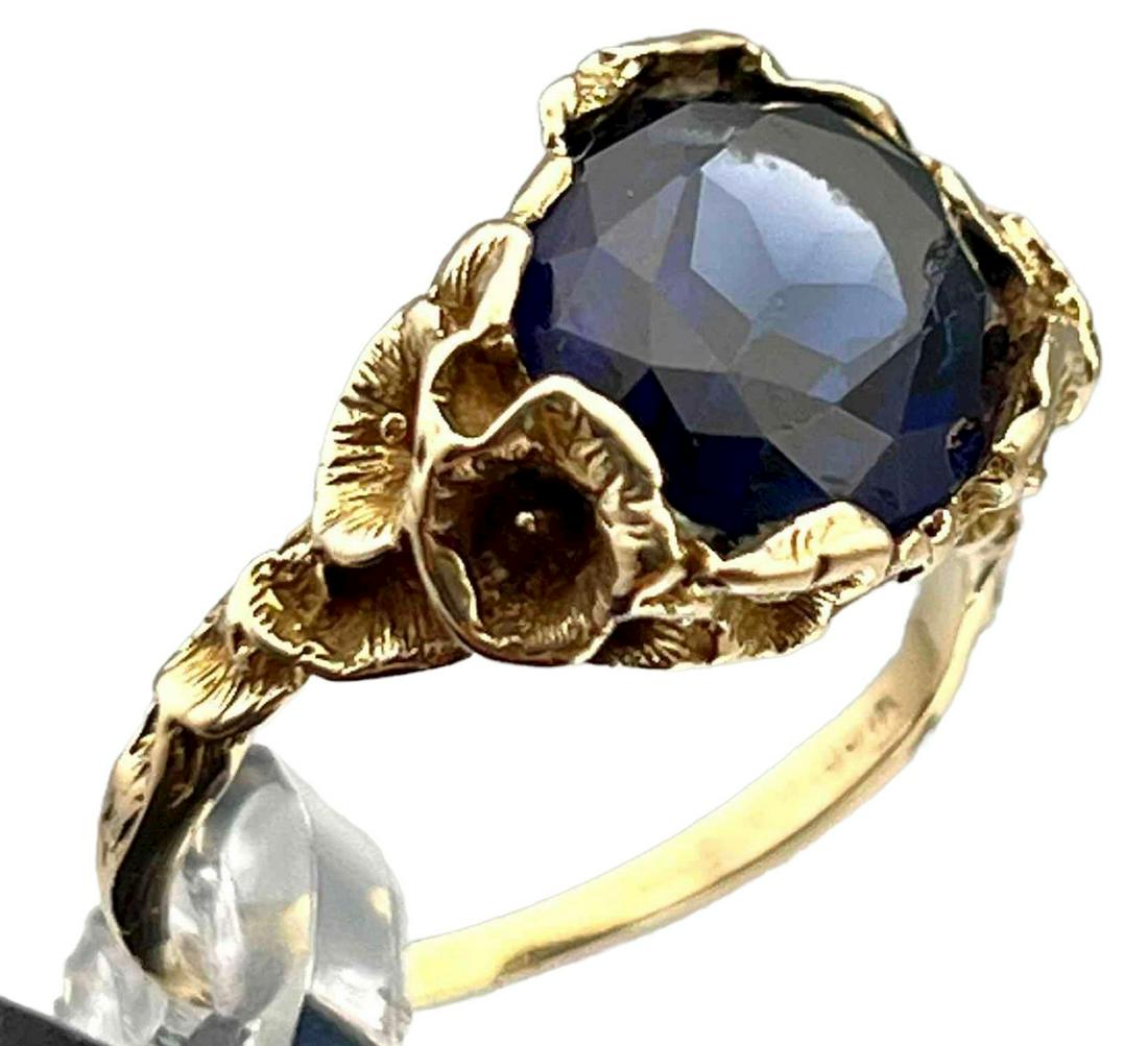 14K Gold Multi Faceted Blue Sapphire Ring: 14K Gold Multi Faceted Blue Sapphire Ring. 4.9g. Marked 14K. Topaz Is Approximately 12.17 L x 9.23 W mm. Approximate Ring Size 7. ALL CREDIT CARDS WILL BE MANUALLY VERIFIED PRIOR TO SHIPMENT.