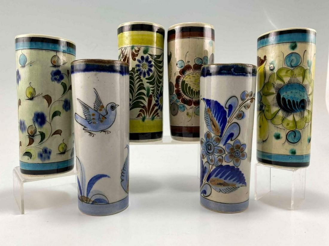 Lot of 6 El Palomar Mexican Pottery Glasses: 6 Hand Painted Mexican Pottery Glasses. Ideal For Ice Tea Glasses or Small Flower Arrangements. Marked El Palomar Mexico, Tonala Mexico CAJ 312. Largest Approximately 7.0H x 2.75W in. Smallest Approxi