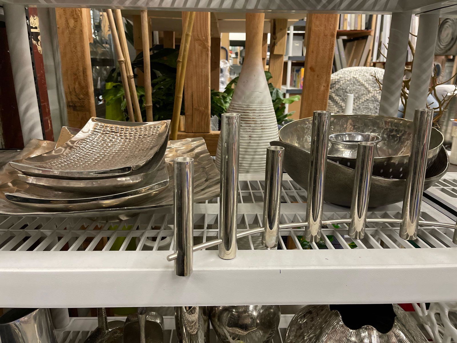 Shelf of decorative metal items bowls candelabra platters (1 of 5)