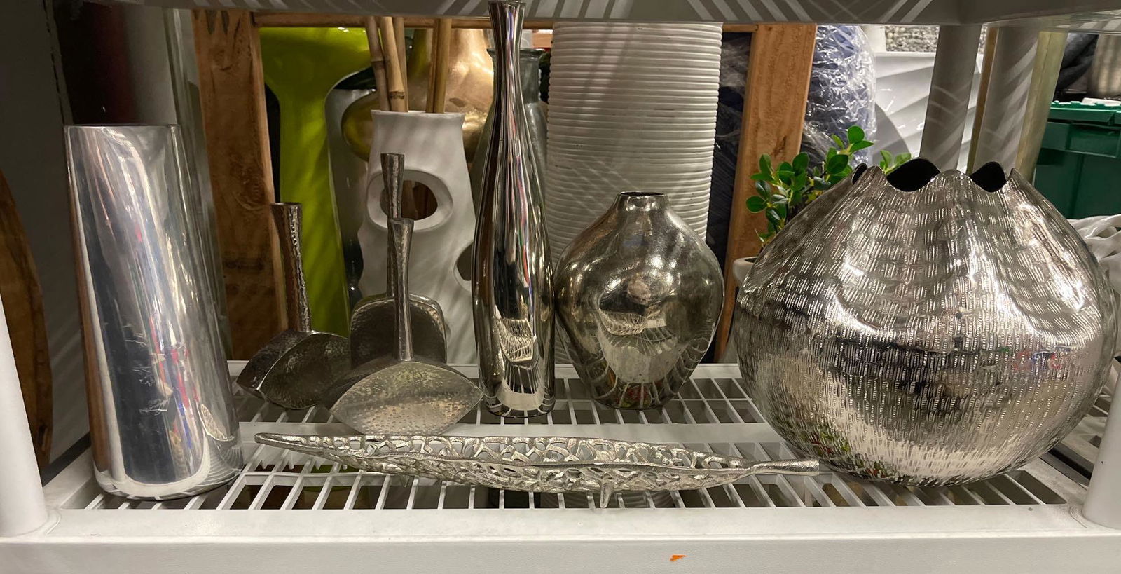 Shelf of metal vases and decorative items (1 of 4)
