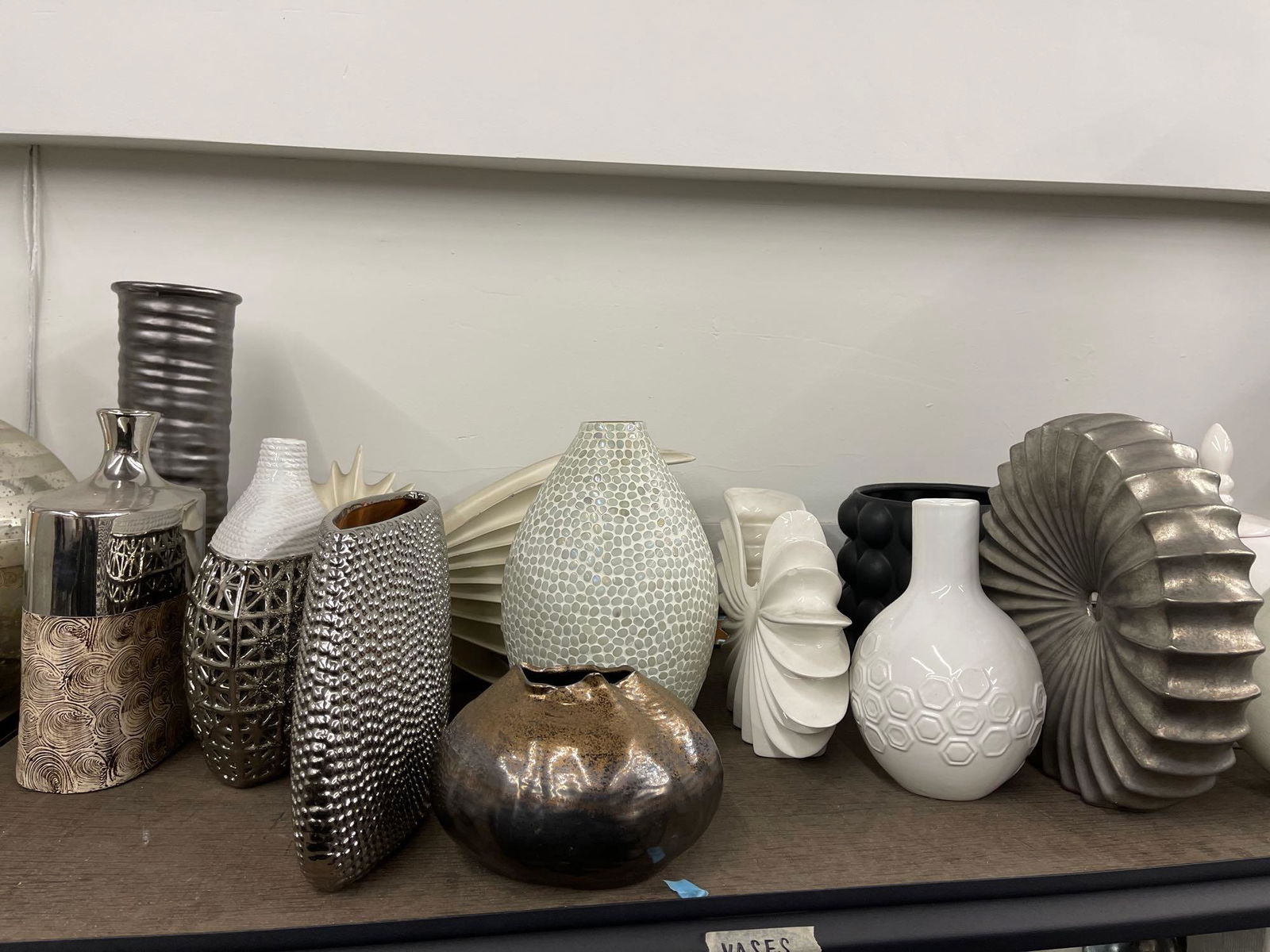 Top shelf of medium vases, mostly ceramic (1 of 5)