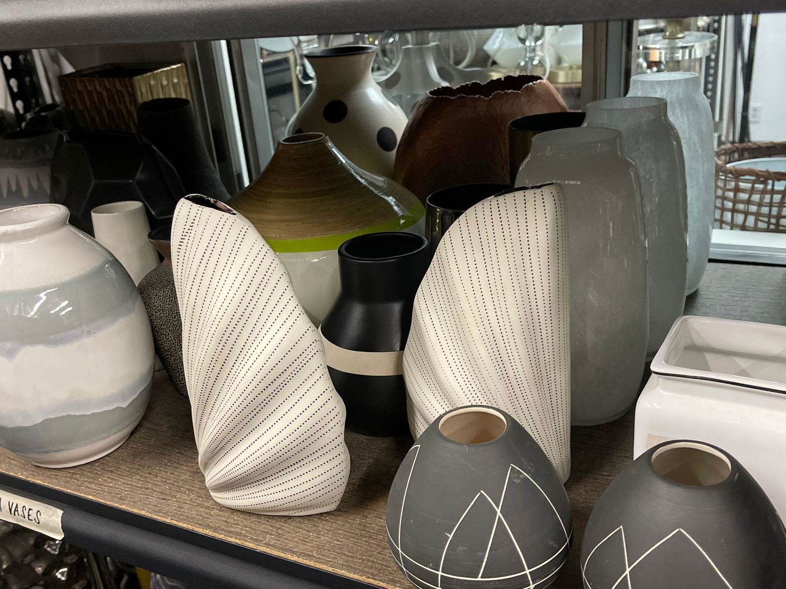 Shelf of medium vases, mostly ceramic (1 of 5)