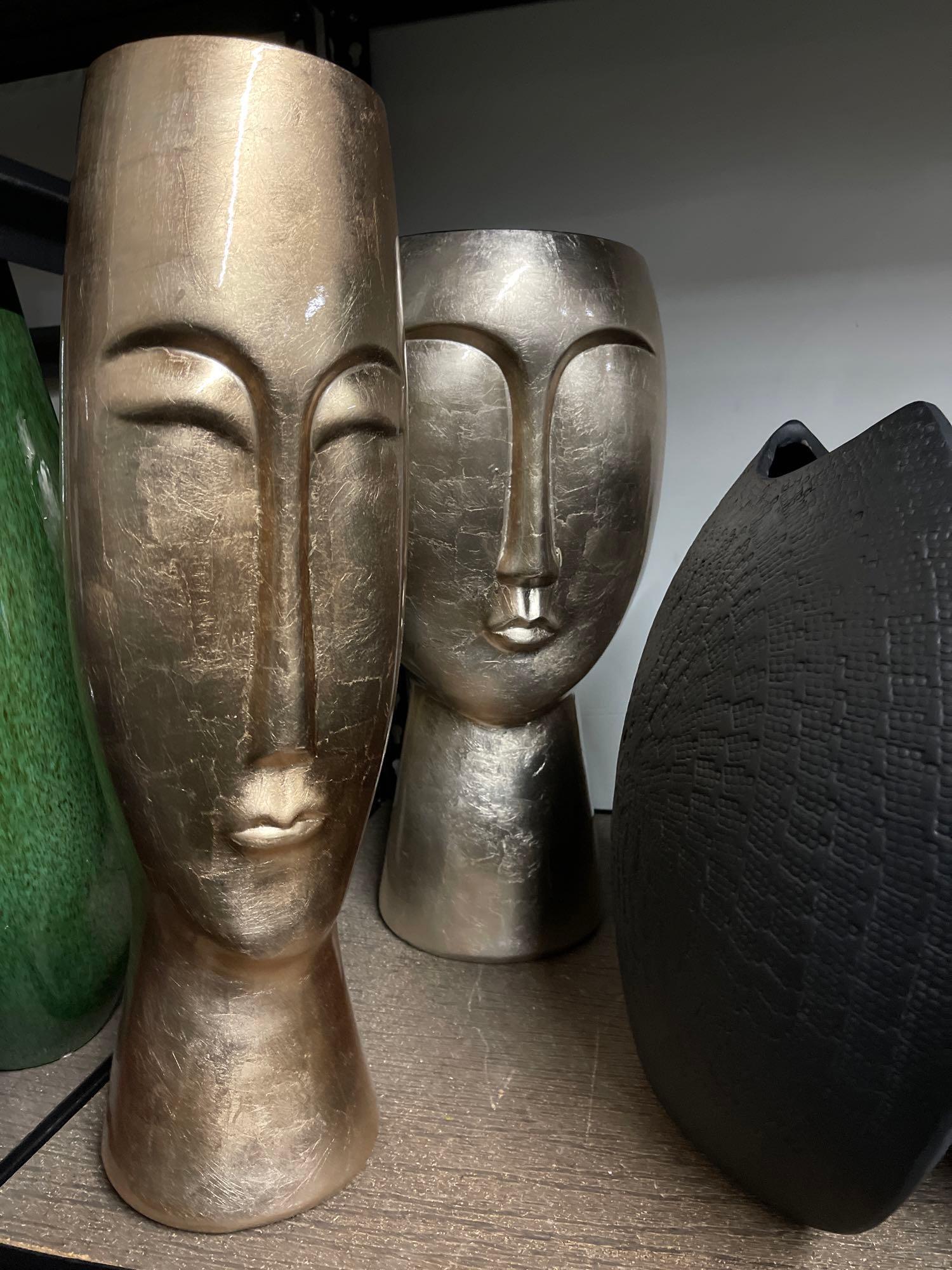 two tall ceramic face vases (1 of 2)
