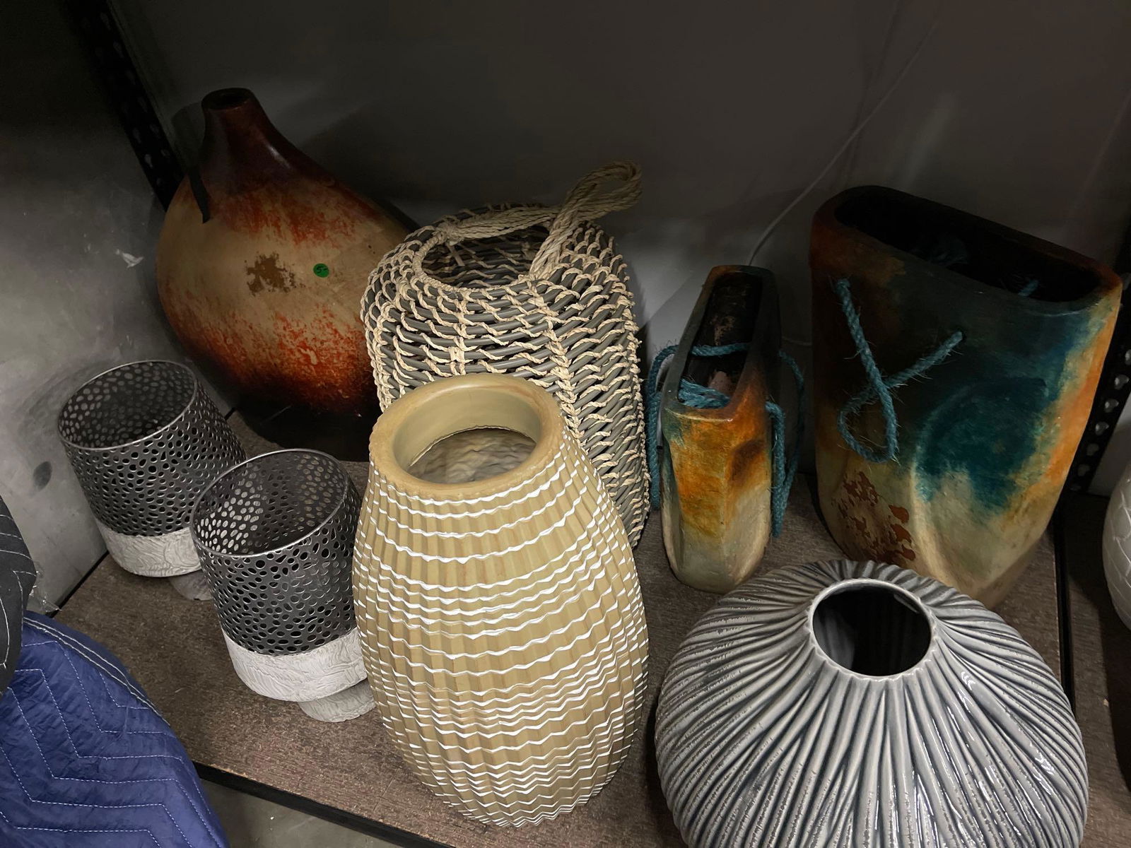 Bottom shelf large decorative vases of various materials (1 of 5)
