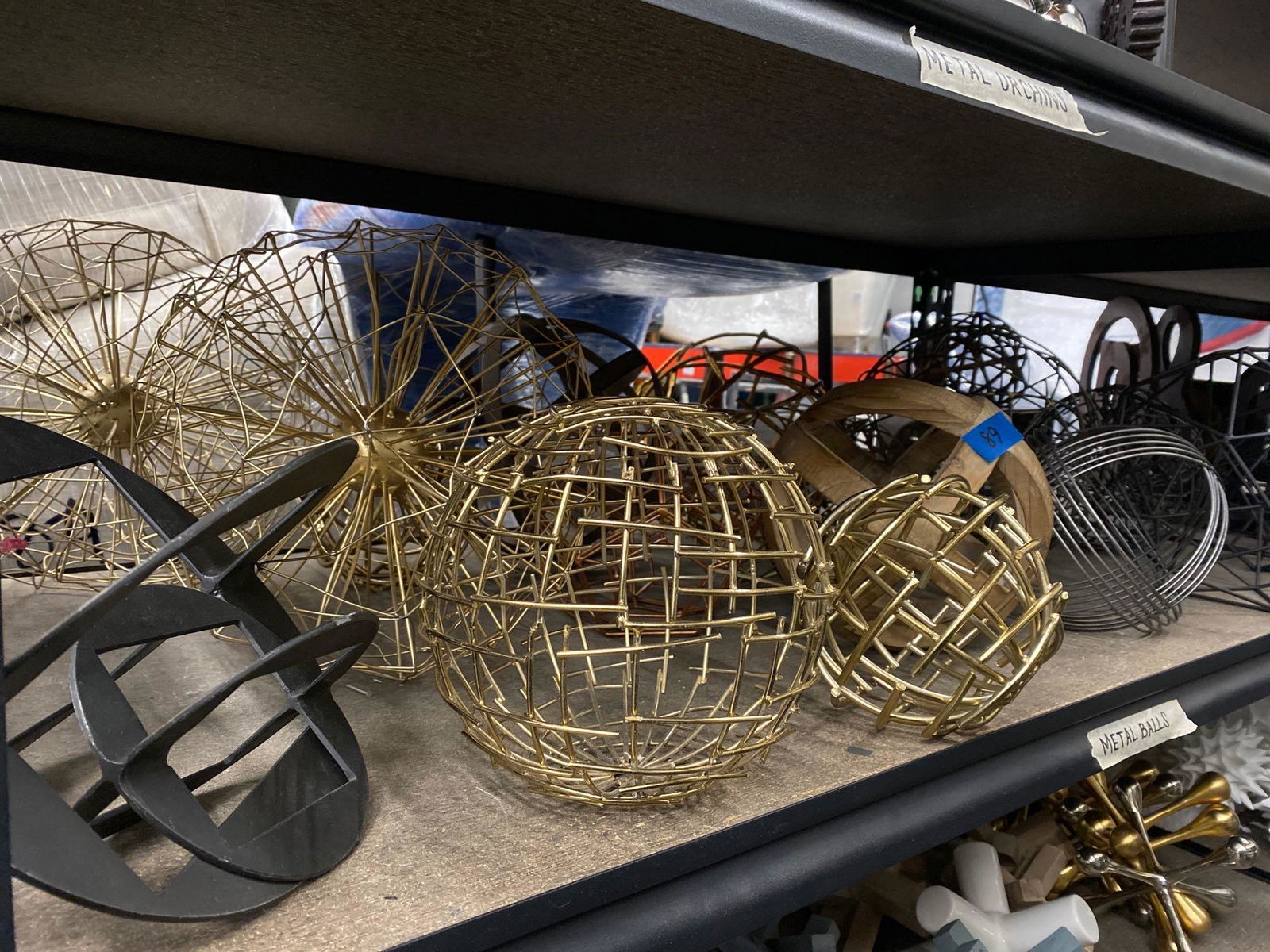 Shelf decorative spheres, shapes, mostly metal (1 of 4)