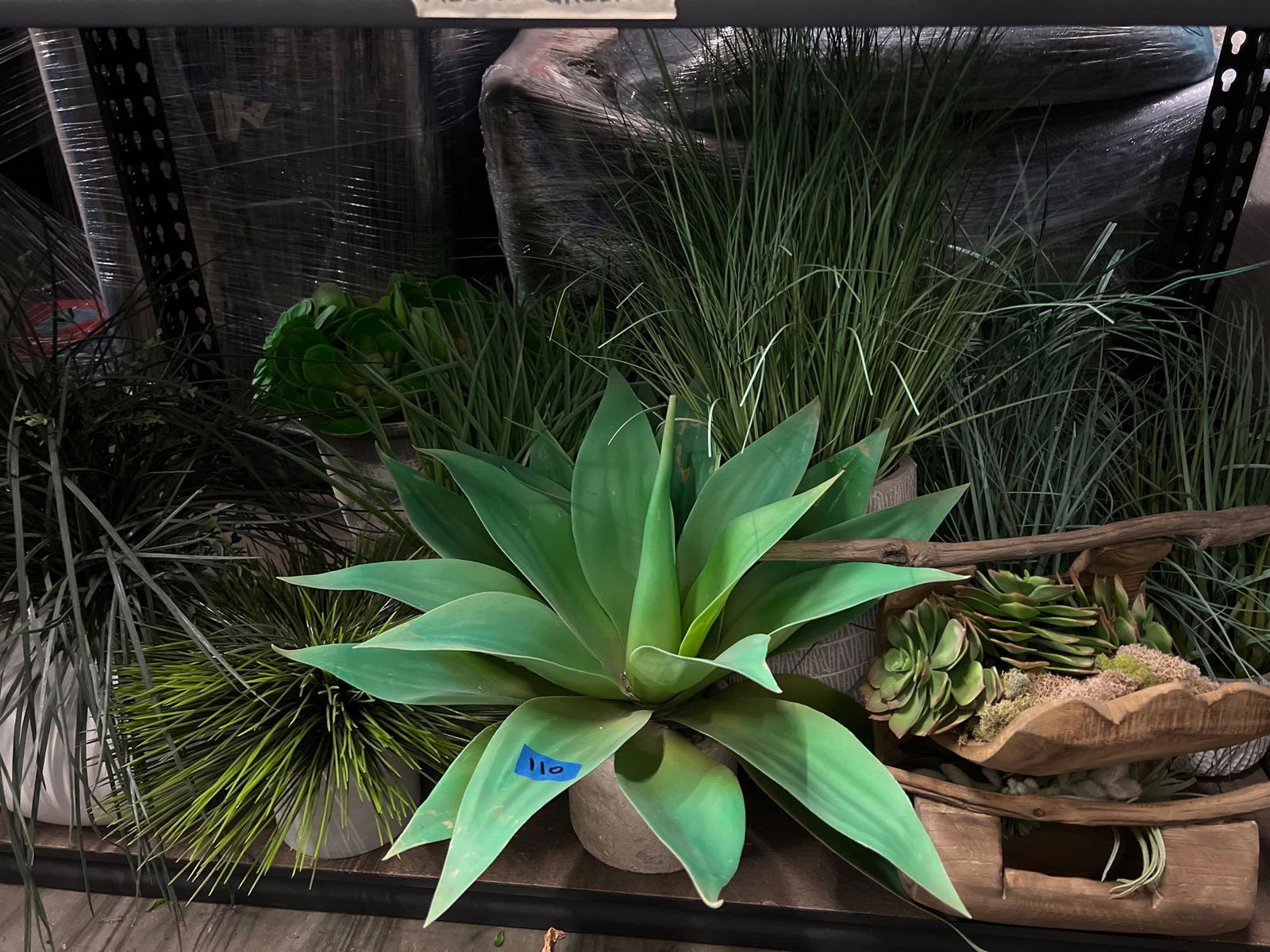 Bottom shelf planters, faux plants (1 of 3)