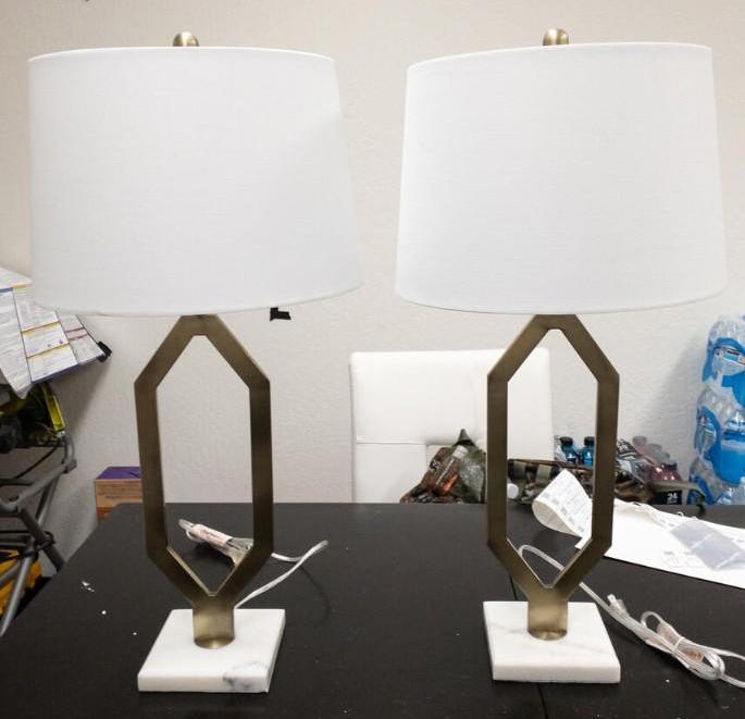 White and gold table lamps: White and gold table lamps Base Dimensions: 30"x6" Shade Dimensions: 10"x13" NO SHIPPING AVAILABLE This will be a two (2) day sale Wed & Thur. Jan. 18th & 19th.. Online only.All items sold as is where