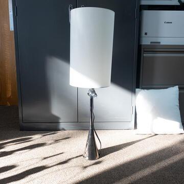 Blake Table Lamp: Table lamp with silver base, Blake 1. Base Dimensions: 27"x4" Shade Dimensions: 15"x9" NO SHIPPING AVAILABLE This will be a two (2) day sale Wed & Thur. Jan. 18th & 19th.. Online only.All items sold a