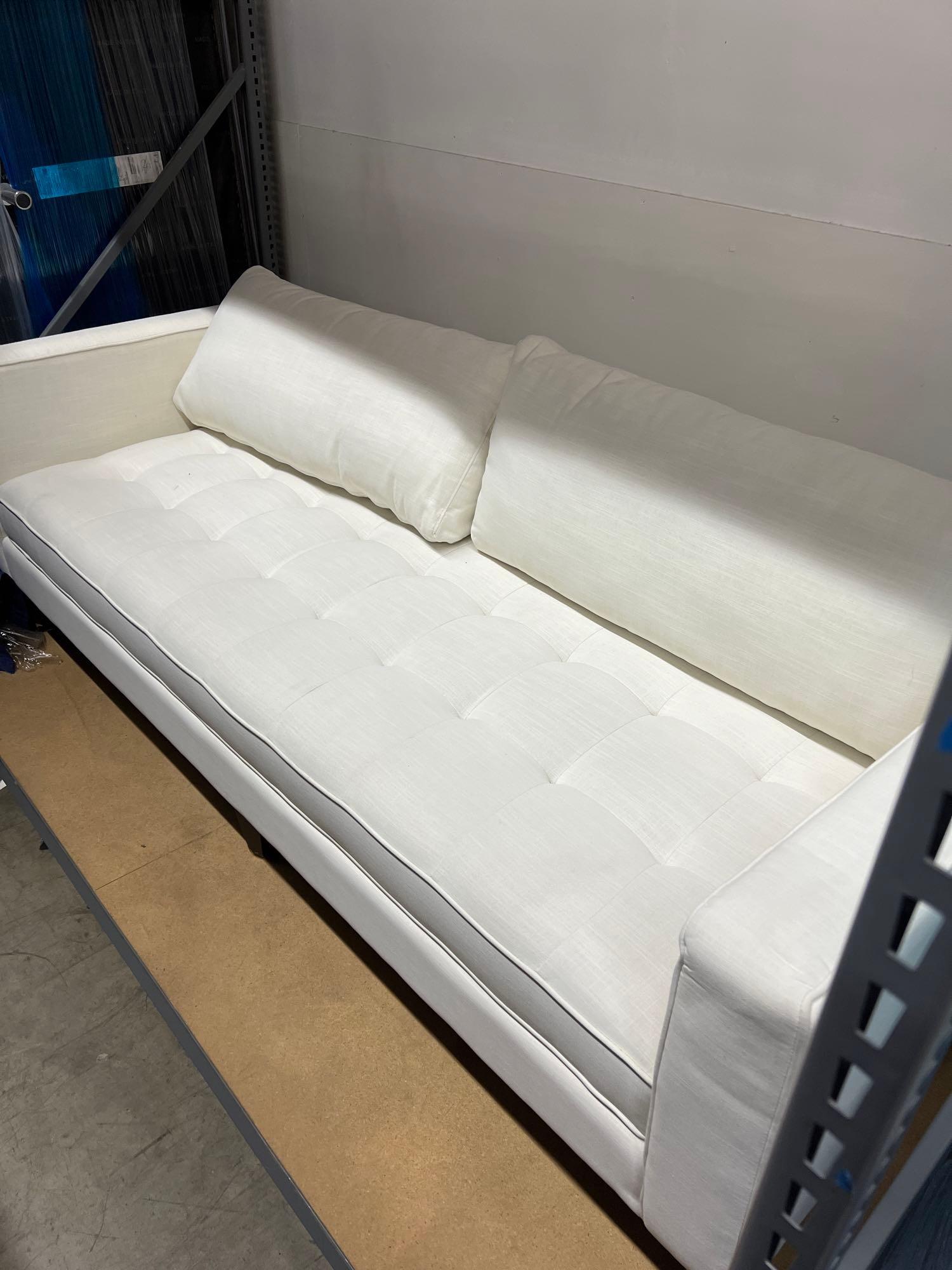 Upholstered Ivory Sofa: Upholstered Ivory Sofa This will be a two (2) day sale Wed & Thr Jan 18th & 19th. Online only. Online only.All items sold as is where is. There are No guarantees to functionality, condition, or fitnes