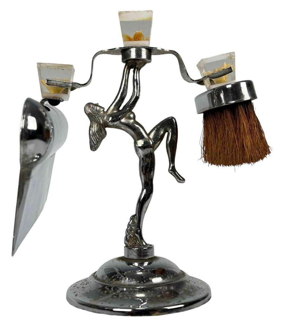 Art Deco Chrome Plated Crumb Set, Nude Woman Sculpture Stand: Art Deco Crumb Set With Lucite Handles And Figural Stand. Stand Approximately 7.5H x 4.75W x 3.75D in. Crumb Scoop Approximately 6.5L x 4.125W x 1.0H in. Brush Approximately 2.875H x 2.5L x 1.25W in.