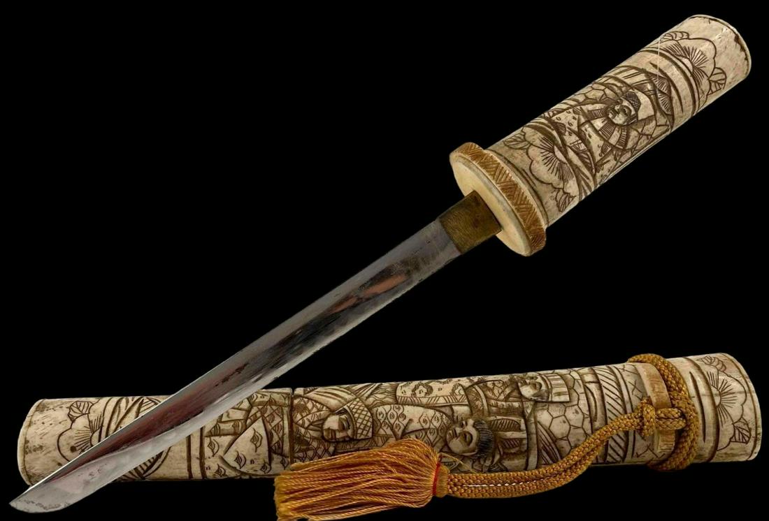 Japanese Bone Scabbard Tanto: Japanese Tanto Dagger With Carved Bone Handle & Sheath. Please note that one area of sheath is loose at joinery. Approximately 13.75L x 1.75W x 1.125D in. Blade Approximately 6.0L x 0.625W in.