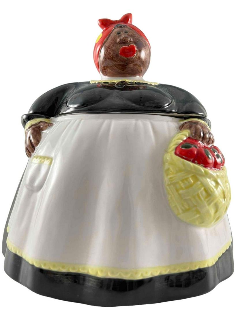 Black Americana Mammy Cookie Jar: Vintage Black Americana Mammy Cookie Jar. Marked Omnibus Japan. Approximately 9.5H x 8.25W x 8.25D in.