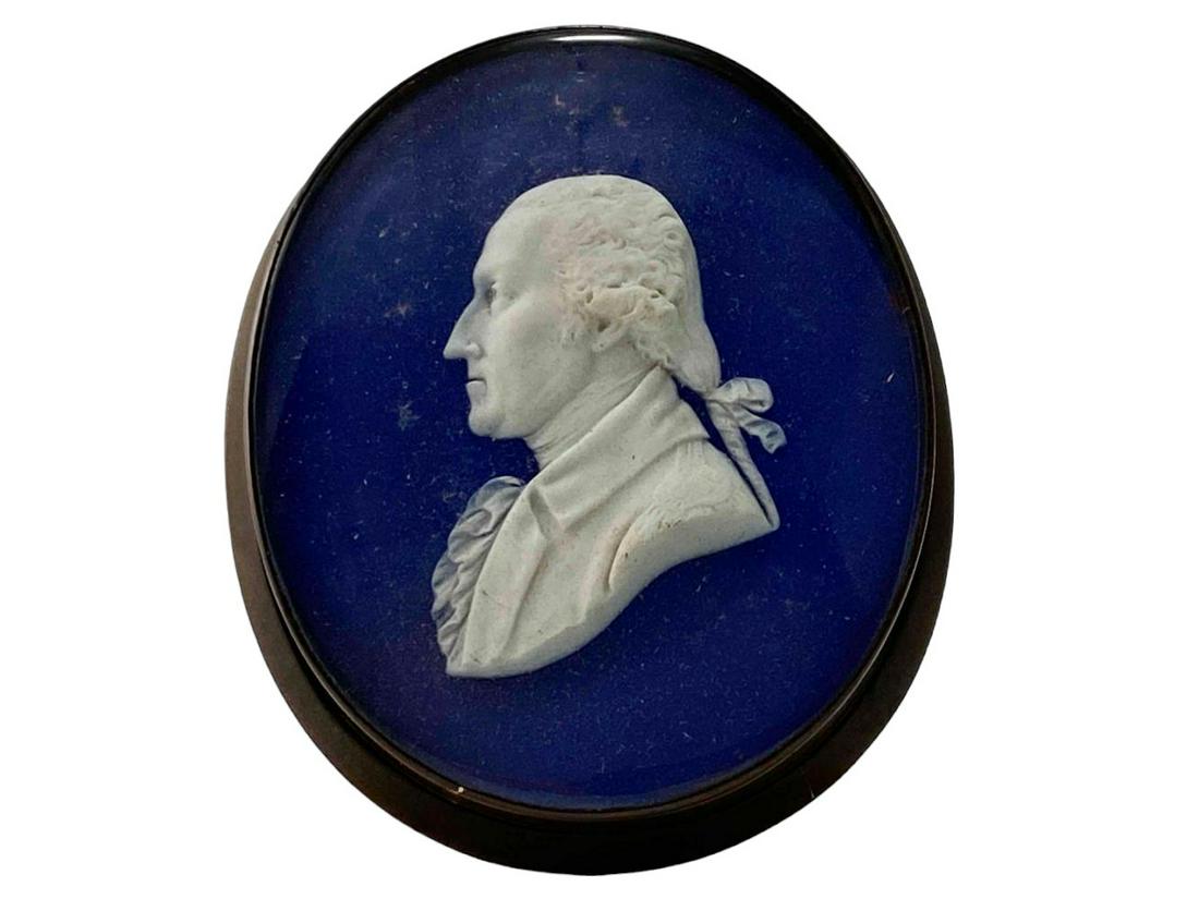 Fine Bisque Porcelain Cameo of Gorge Washington, Manner of Wedgewood: Fine White Bisque Porcelain Cameo of Gorge Washington, Manner of Wedgewood. Portrait In Copper Frame on Blue Ground. Approximately 3.375L x 2.75W x 0.625D in. Sight Approximately 3.125L x 2.5W in.