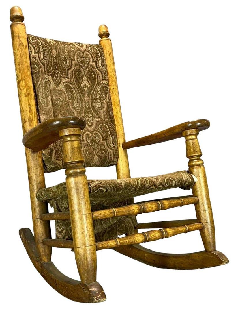 Large Paddle Arm Antique Rocking Chair: Unusual Antique Carved Wooden Rocking Chair. Approximately 46.375H x 31.375W x 36.5D in.