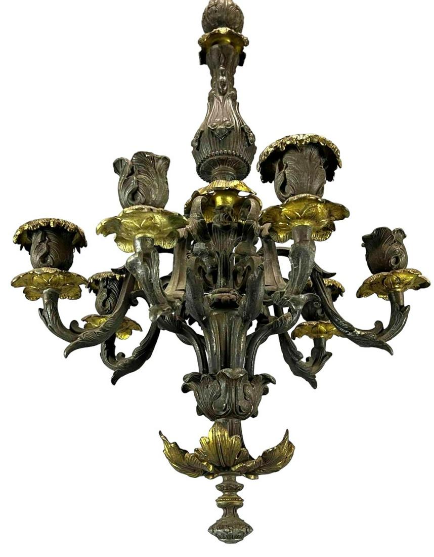 Antique Bronze and Gilt Bronze Candle Chandelier: Antique Bronze and Gilt Bronze Candle Chandelier. Please note that arms are moveable, and some areas are loose at joinery. Approximately 28.5L x 15.625W in. Chain Approximately 25.75L in.