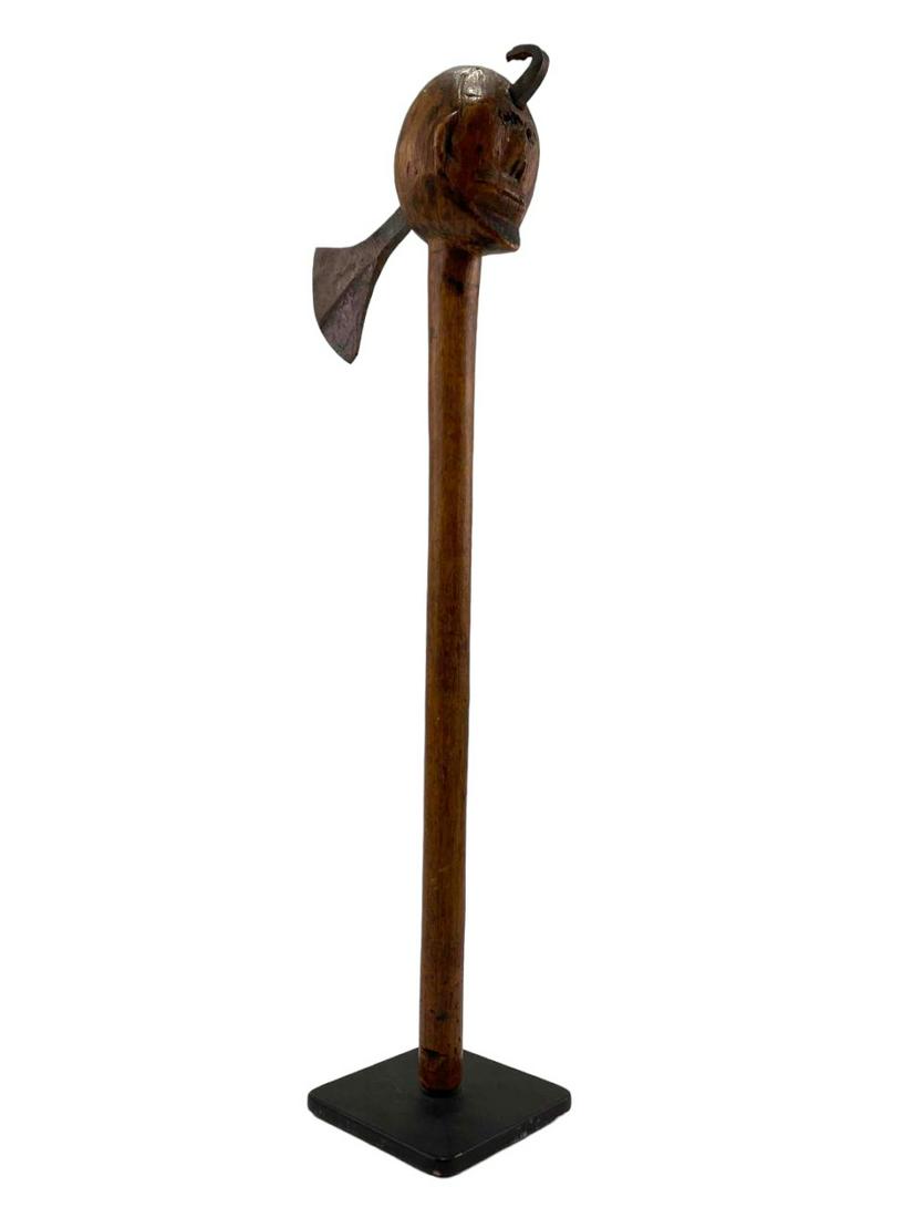 Antique Ovimbunda Angolan Figural Axe: South African Wood And Figural Axe. Attached Tags Read: "Nquni So Africa, Ovimbunda Angola." Approximately 16.0H x 6.375W x 2.375D in. With Stand Approximately 16.125H x 6.375W x 3.0D in.
