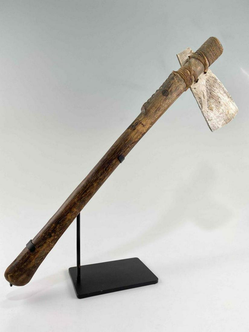Papua New Guinea Matty Island (Wuvula) Bone & Wood Axe: Papua New Guinea Matty Island (Wuvula) Bone & Wood Axe. Attached Tag Reads: "Matty Island." Axe Approximately 23.25L x 7.25W x 1.25D in. On Stand Approximately 18.75H x 19.0W x 4.0D in.