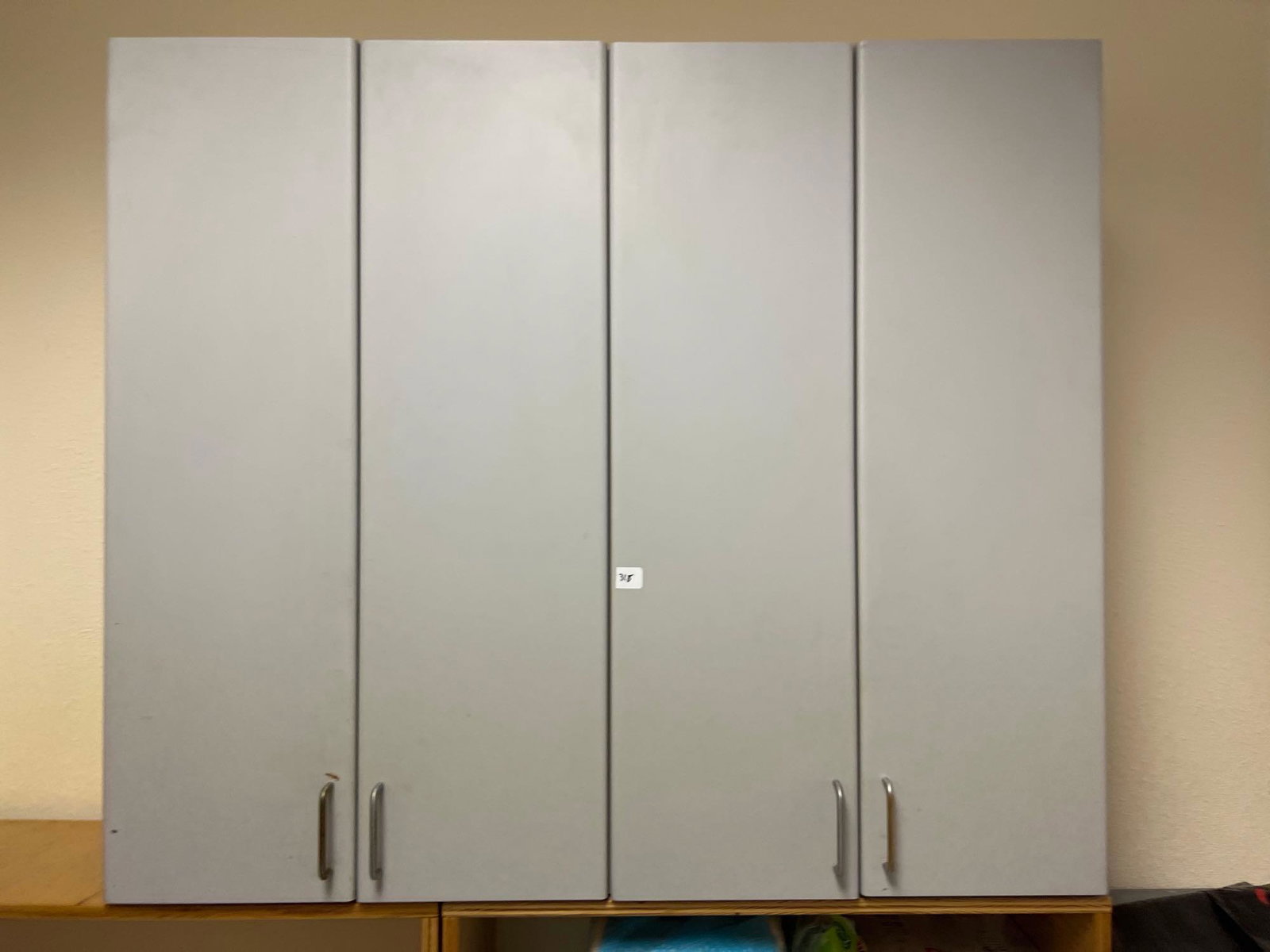 4 Door Wall Mounted Cabinet: 4 Door Wall Mounted Cabinet NO SHIPPING AVAILABLE All items sold as is where is. There are No guarantees to functionality, condition, (owner of business states that items are functional Clark's does N