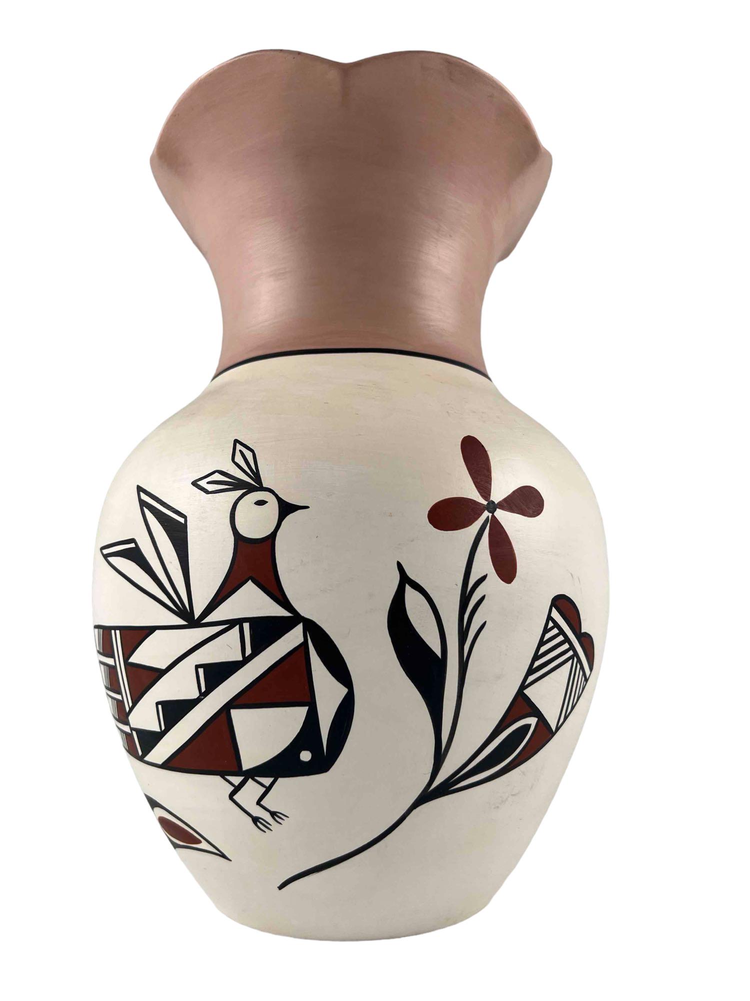 New Mexico Pottery Vase. Marked Olguin Isleta: New Mexico Pottery Vase. Marked Olguin Isleta, NM. Approximately 10.625H x 7.0W in.